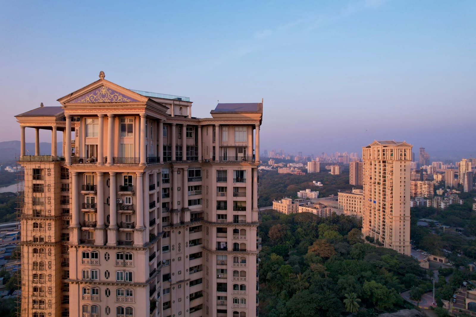 High-rise residential towers at Hiranandani Gardens in Powai, Mumbai, at sunset.